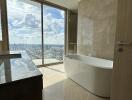 Modern bathroom with large window and city view