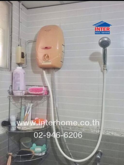 Well-equipped shower area with toiletries and water heater