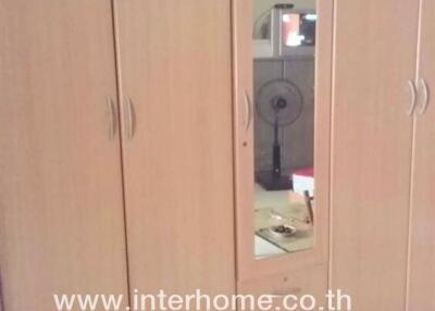 Wardrobe with a mirror in a bedroom