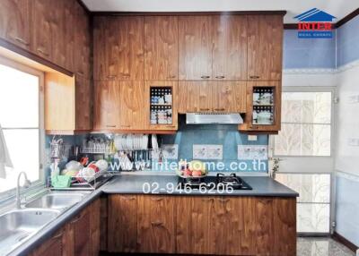 Spacious kitchen with wooden cabinets and modern appliances