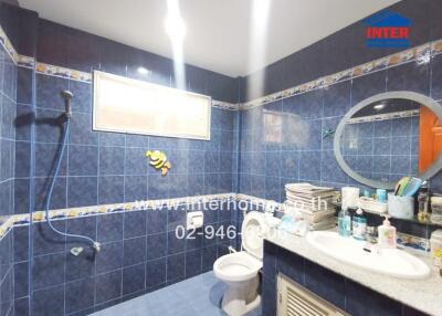 Bathroom with blue tiles and modern fixtures