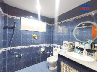 Bathroom with blue tiles and modern fixtures