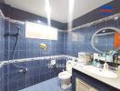 Bathroom with blue tiles and modern fixtures