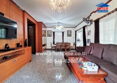 Spacious living room with modern amenities and dining area