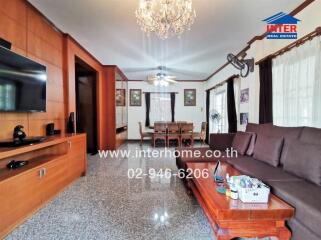 Spacious living room with modern amenities and dining area