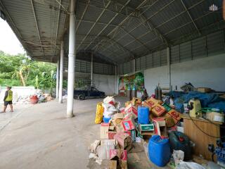 Large covered open area with storage and various items