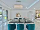 Bright dining room with modern decor and large chandelier