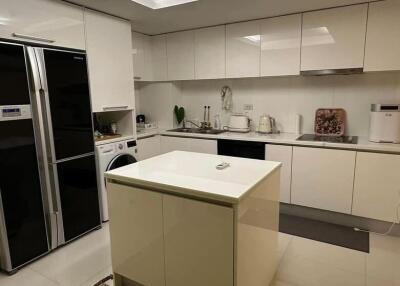 Modern kitchen with white cabinetry and appliances