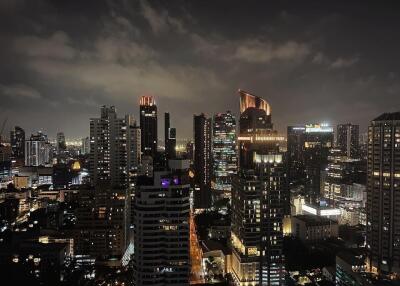 Night view of city skyline with illuminated buildings