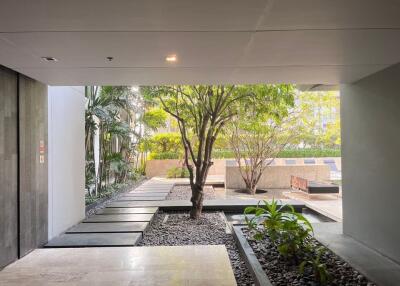 Apartment building entrance with outdoor garden