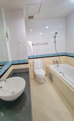 Modern bathroom with bathtub and toilet