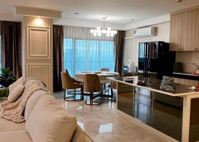 Spacious living room connected to an open kitchen area