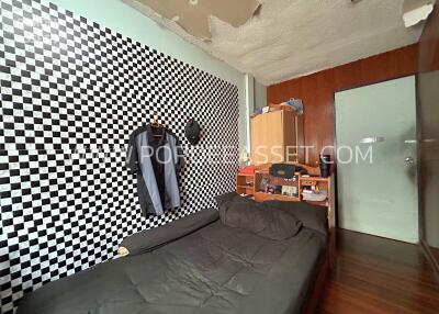 Bedroom with checkered wall design