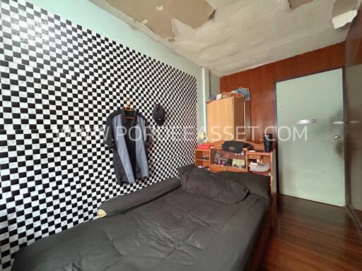 Bedroom with checkered wall design