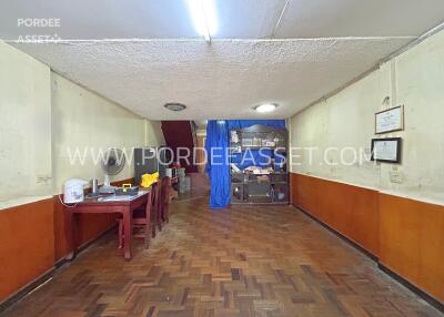 Basement space with wooden flooring and work area