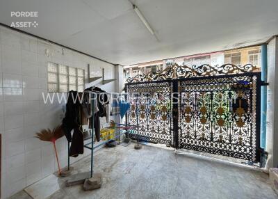 Covered outdoor area with ornate metal gate