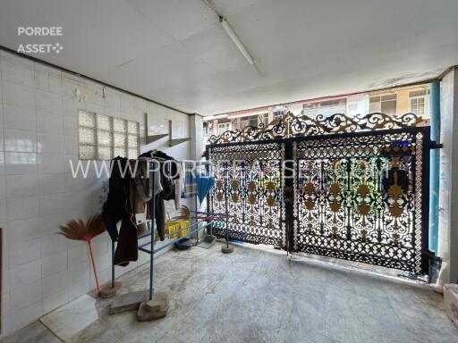 Covered outdoor area with ornate metal gate