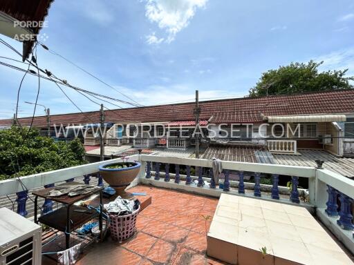 balcony view with rooftops