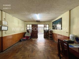 Living room with wooden flooring and wall decorations