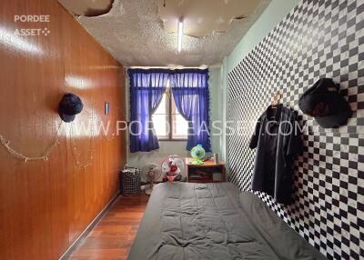 Bedroom with wall decor and visible window