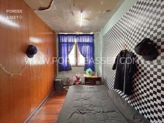 Bedroom with wall decor and visible window