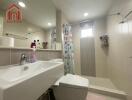 Modern bathroom with sink, toilet, shower, and colorful shower curtain