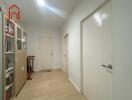 Spacious Hallway with Wooden Flooring and Bookshelf