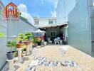 Sunny patio with plants and seating area