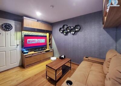 Modern living room with entertainment center and couch