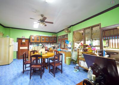 Spacious kitchen with dining table and wooden cabinets