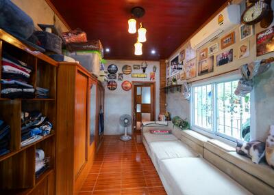 Cozy living room with wall decorations and plenty of storage