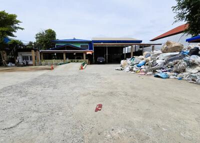 Outdoor view with multiple buildings and waste area