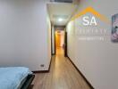 Bedroom with wooden flooring and wall art