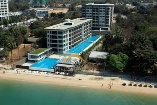 Aerial view of a beachfront property with swimming pools