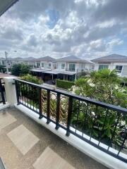 View from balcony overlooking residential neighborhood