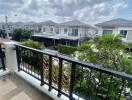 View from balcony overlooking residential neighborhood