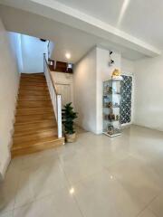 Foyer with stairs and display cabinet