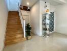 Foyer with stairs and display cabinet