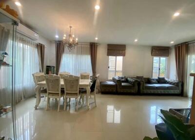 Spacious and well-lit living room with dining area