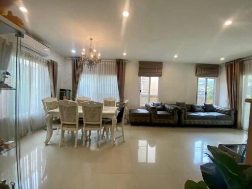 Spacious and well-lit living room with dining area