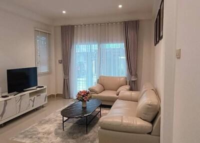 Well-lit living room with modern furnishings