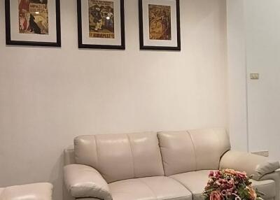 Living room with comfortable seating and wall art