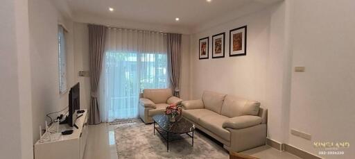 Modern living room with white furniture and decor