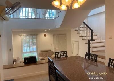 Main living space with dining area and staircase