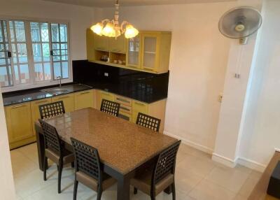 Modern kitchen with dining table