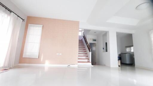 Bright main living area with staircase