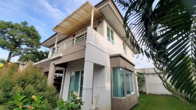 two-story house with a garden