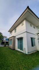 Two-story house with a lawn