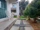 Outdoor patio area with chairs and trees