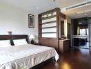 Spacious modern bedroom with ample storage and large windows